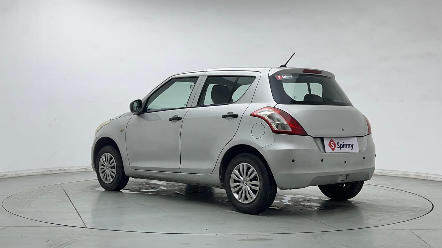 Used 2015 Maruti Suzuki Swift Lxi (O) Petrol Manual exterior LEFT REAR CORNER VIEW