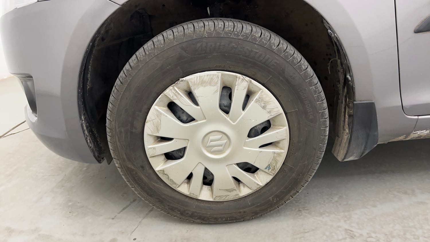 Used 2014 Maruti Suzuki Swift VXi Petrol Manual tyres LEFT FRONT TYRE RIM VIEW