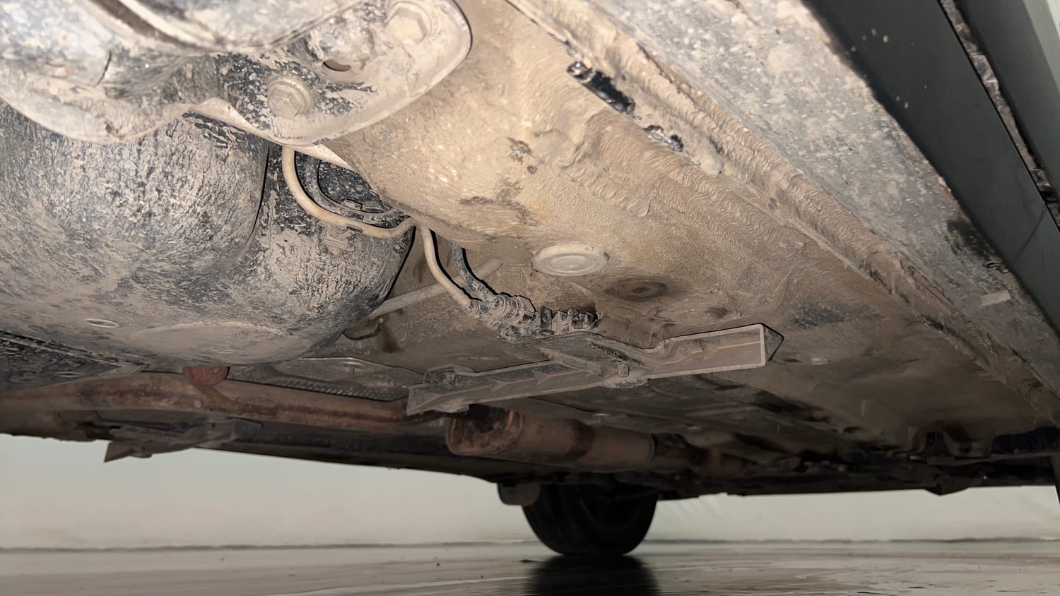 Used 2022 Volkswagen Taigun Topline 1.0 TSI MT Petrol Manual extra REAR RIGHT UNDERBODY VIEW
