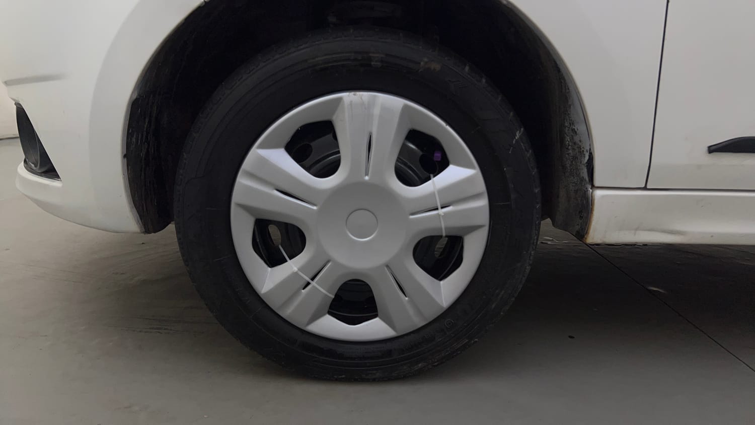 Used 2016 Tata Tiago Revotron XT Petrol Manual tyres LEFT FRONT TYRE RIM VIEW