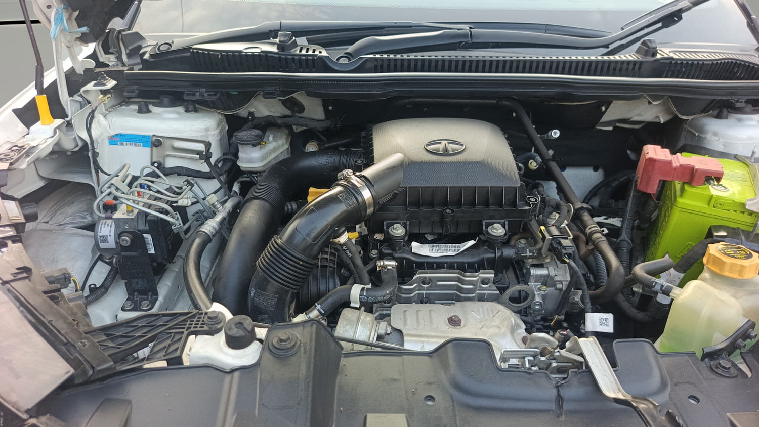Used 2024 Tata Nexon Fearless Plus S 1.2 Revotron Petrol 7DCA DT Petrol Automatic engine ENGINE RIGHT SIDE HINGE & APRON VIEW