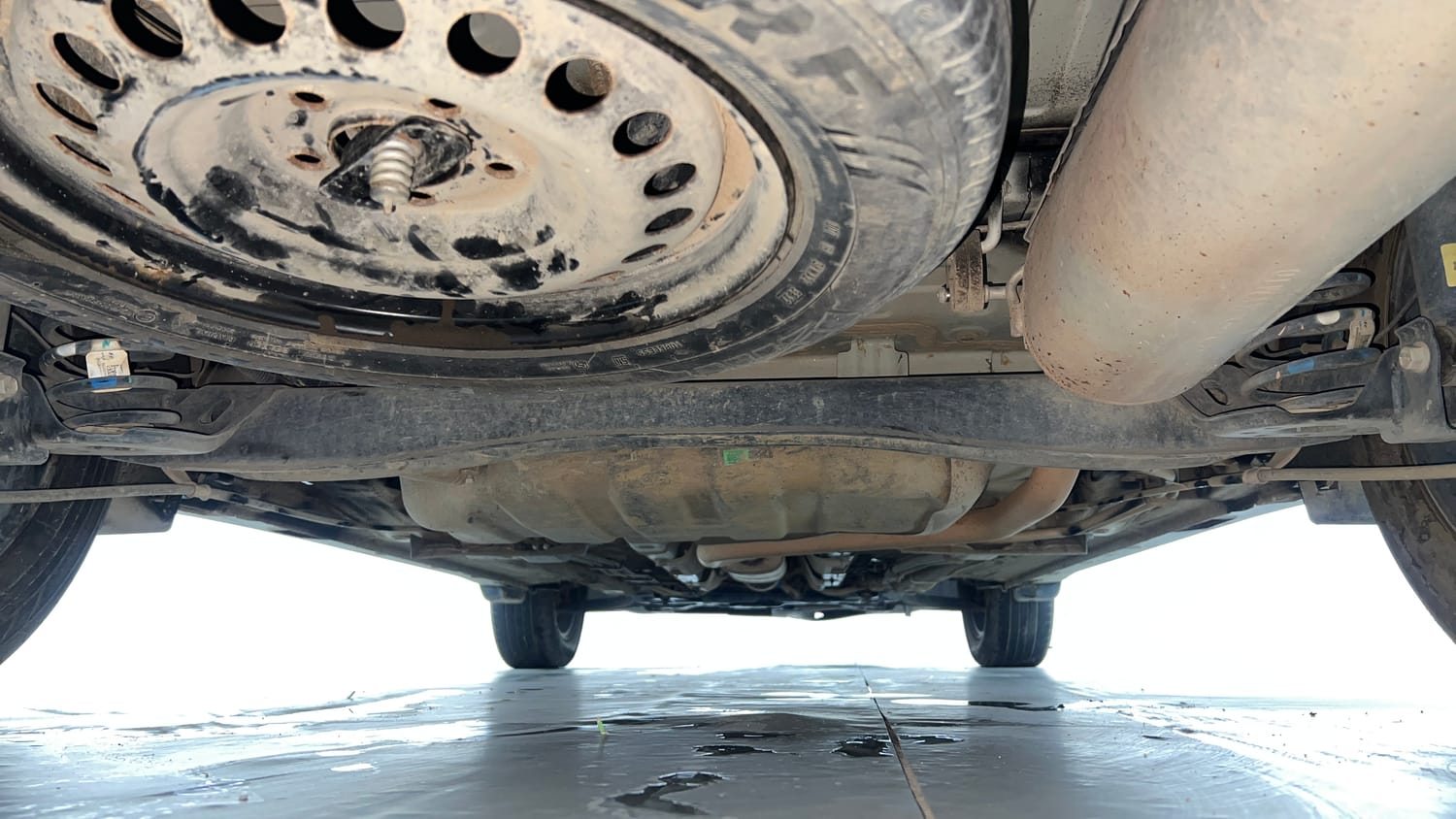Used 2022 Kia Carens Luxury Plus 1.4 Petrol DCT 7 STR Petrol Automatic extra REAR UNDERBODY VIEW (TAKEN FROM REAR)