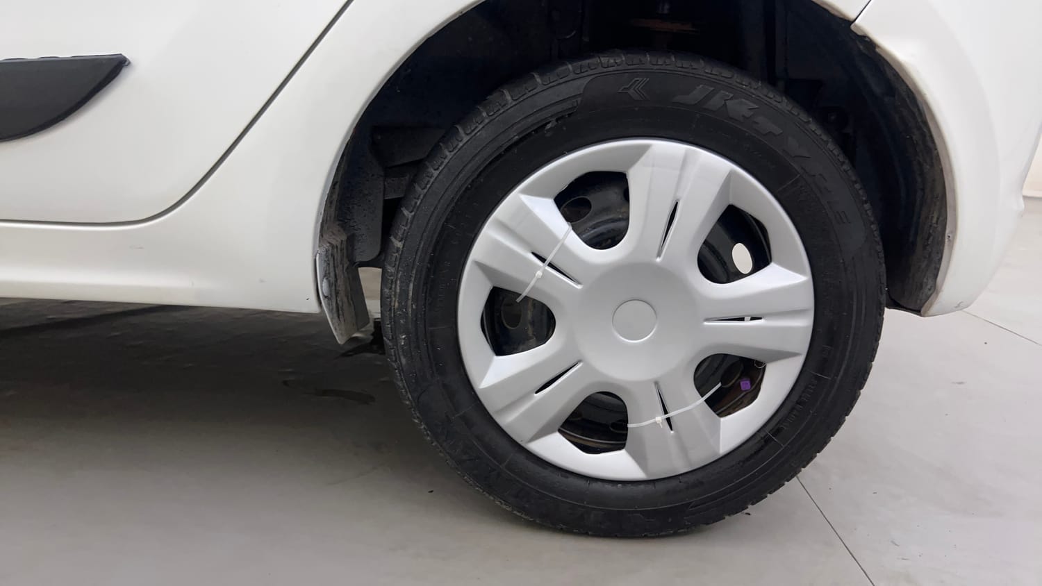 Used 2016 Tata Tiago Revotron XT Petrol Manual tyres LEFT REAR TYRE RIM VIEW