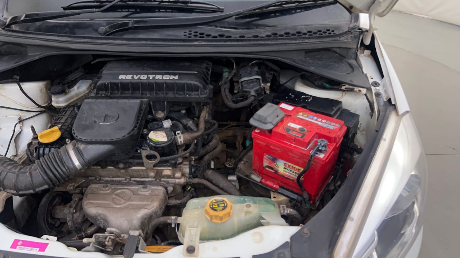 Used 2016 Tata Tiago Revotron XT Petrol Manual engine ENGINE LEFT SIDE HINGE & APRON VIEW
