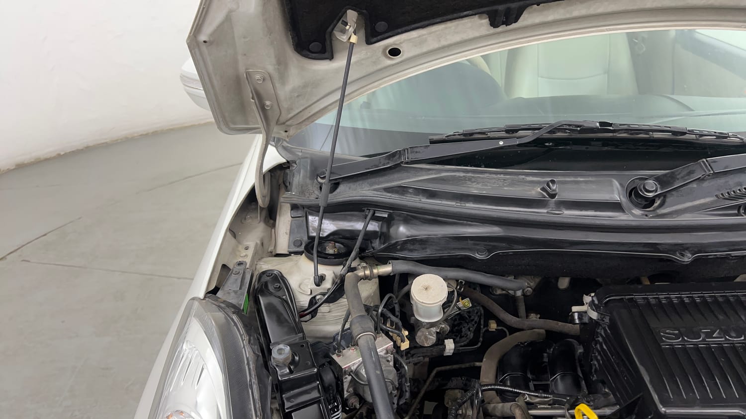 Used 2012 Maruti Suzuki Swift Dzire ZXI Petrol Manual engine ENGINE RIGHT SIDE HINGE & APRON VIEW