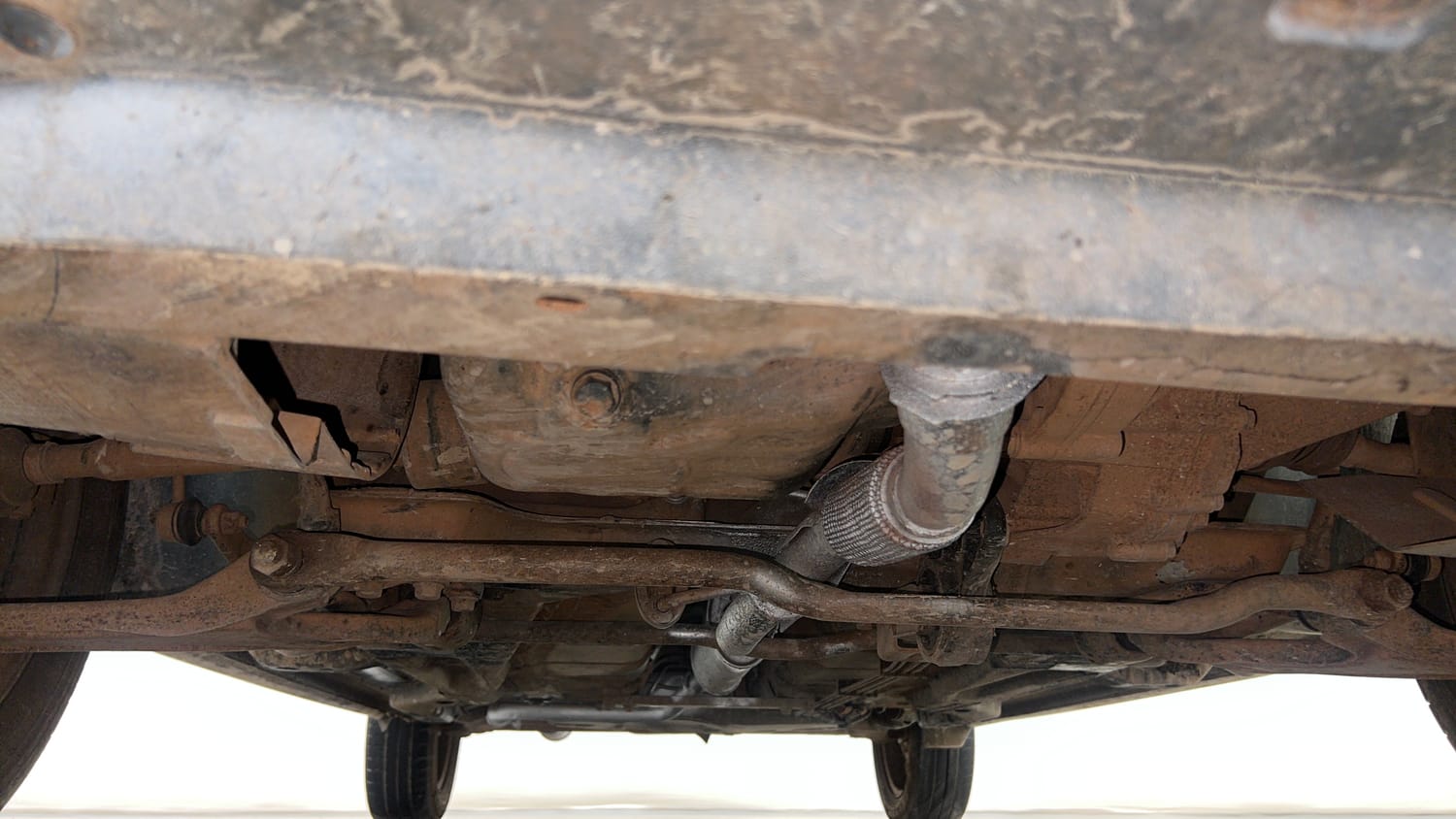 Used 2016 Tata Tiago Revotron XT Petrol Manual extra FRONT LEFT UNDERBODY VIEW