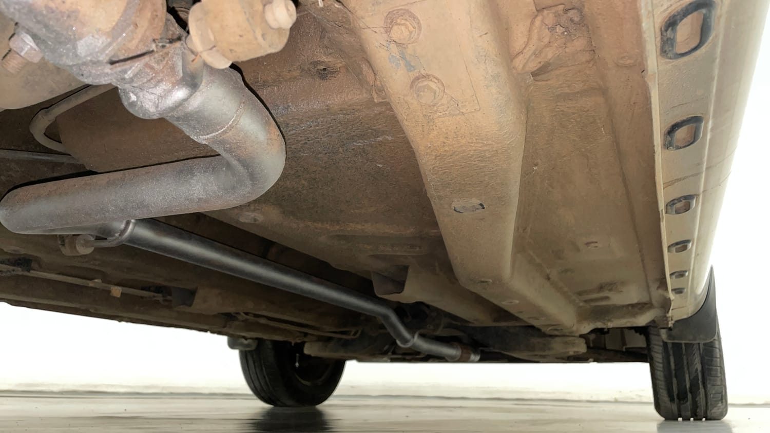 Used 2015 Tata Zest XM Petrol Petrol Manual extra REAR RIGHT UNDERBODY VIEW