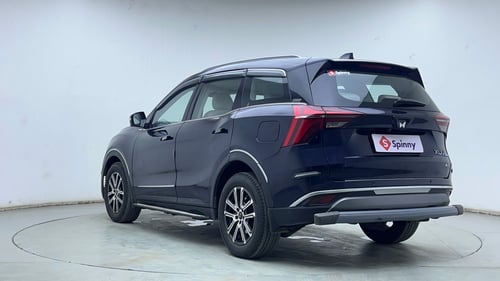 Used 2024 Mahindra XUV700 AX7 Luxury Pack Petrol AT 7 STR Petrol Automatic exterior LEFT REAR CORNER VIEW
