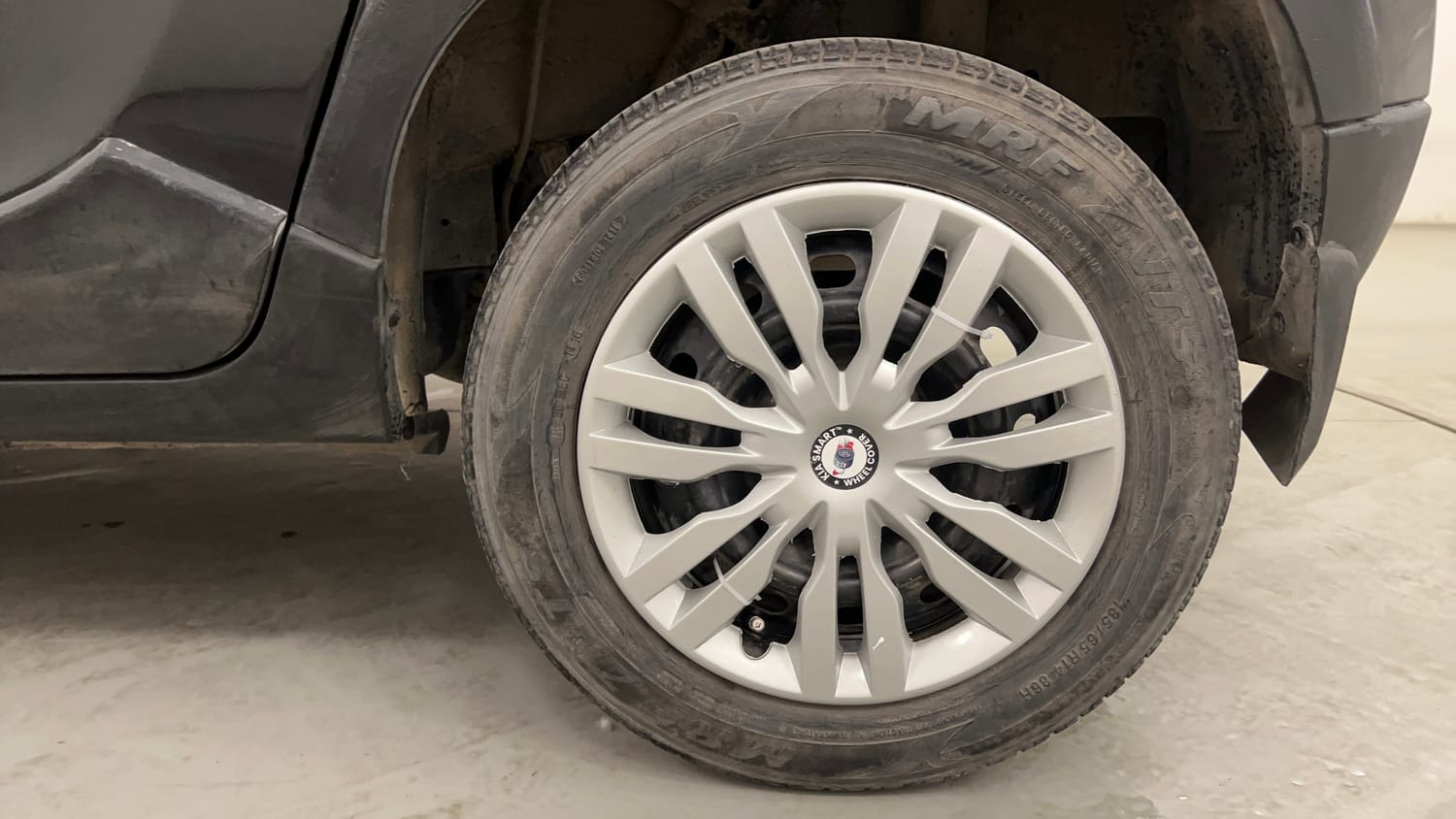 Used 2016 Mahindra KUV100 K6 6 STR Petrol Manual tyres LEFT REAR TYRE RIM VIEW