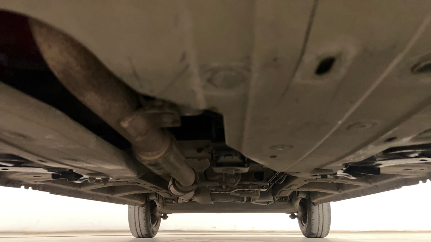 Used 2016 Mahindra KUV100 K6 6 STR Petrol Manual extra FRONT LEFT UNDERBODY VIEW