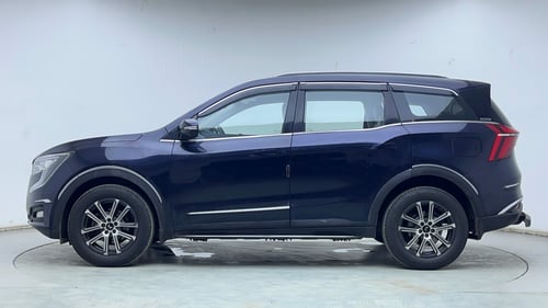 Used 2024 Mahindra XUV700 AX7 Luxury Pack Petrol AT 7 STR Petrol Automatic exterior LEFT SIDE VIEW