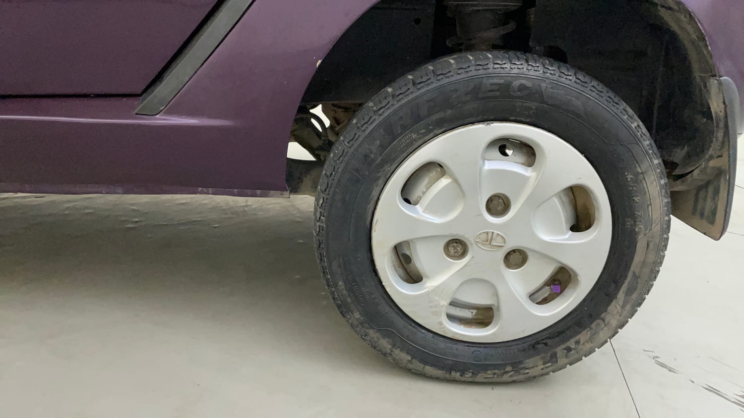 Used 2015 Tata Nano Twist XTA Petrol Automatic tyres LEFT REAR TYRE RIM VIEW