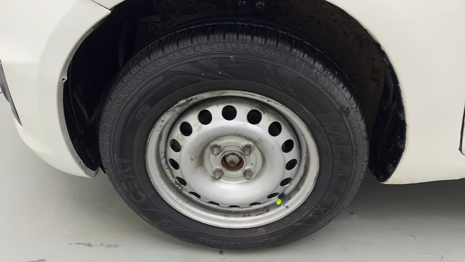 Used 2015 Maruti Suzuki Swift Lxi (O) Petrol Manual tyres LEFT FRONT TYRE RIM VIEW