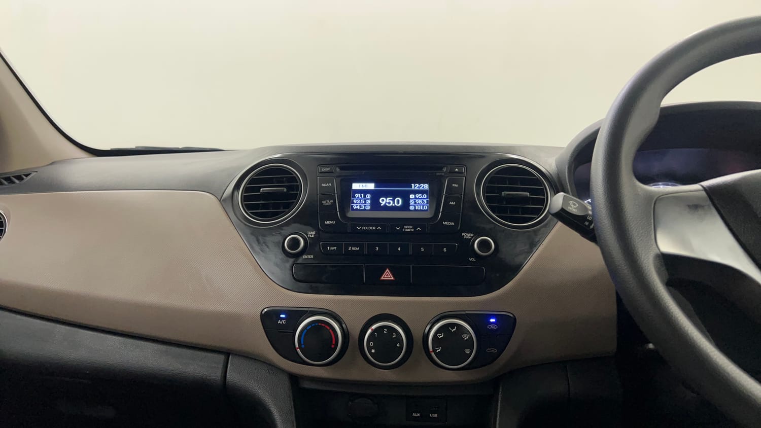 Used 2014 Hyundai Grand i10 Sportz 1.2 Kappa VTVT Petrol Manual interior MUSIC SYSTEM & AC CONTROL VIEW