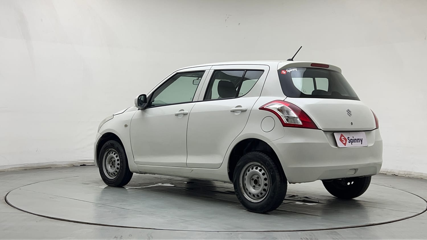 Used 2015 Maruti Suzuki Swift Lxi (O) Petrol Manual exterior LEFT REAR CORNER VIEW