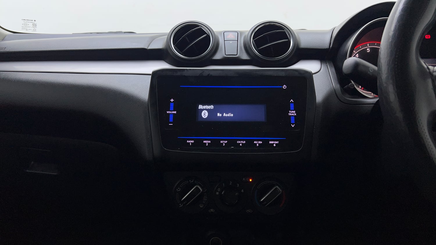 Used 2021 Maruti Suzuki Swift VXi Petrol Manual top_features Integrated (in-dash) music system