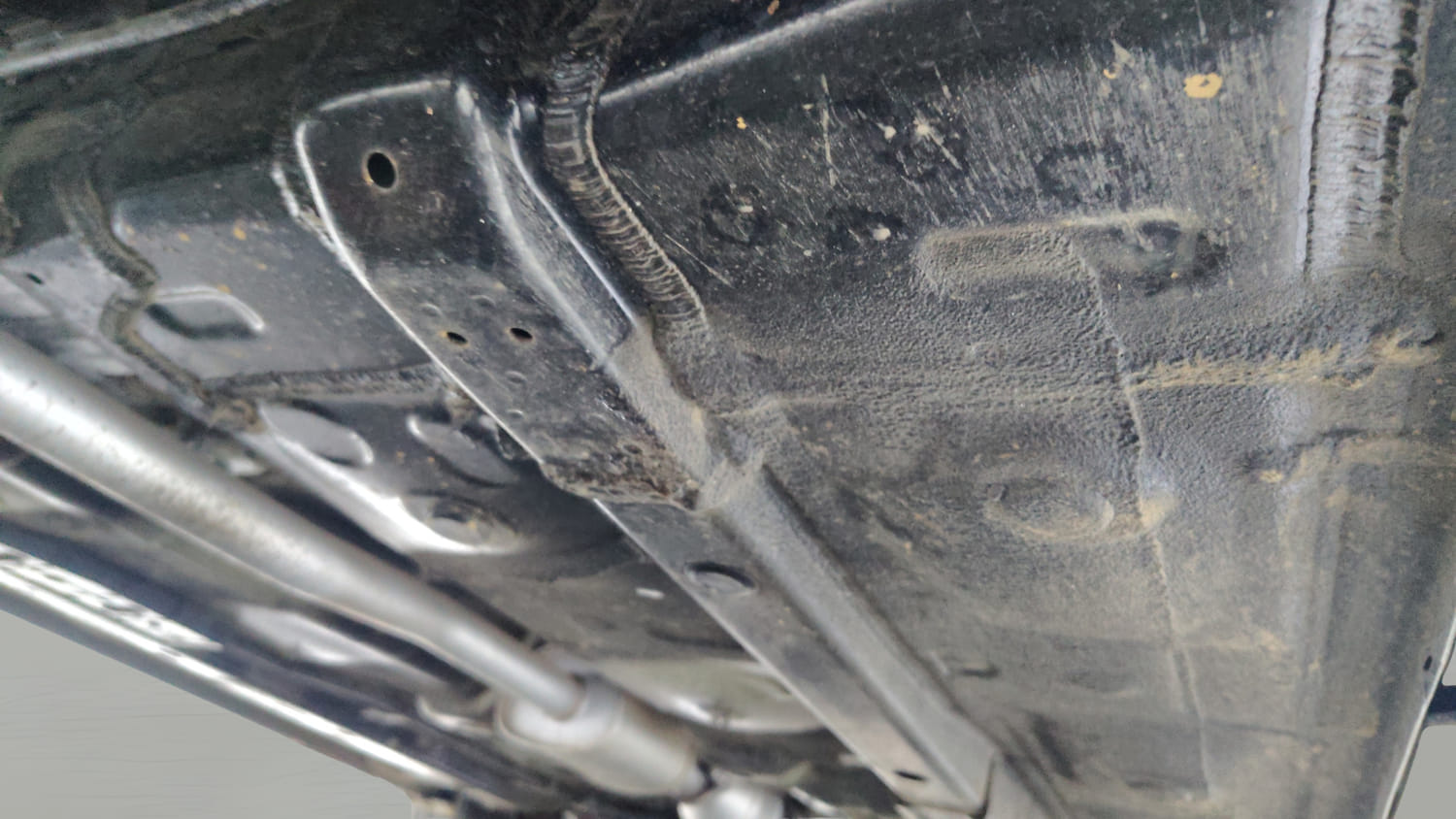 Used 2025 Hyundai Exter SX (O) Connect 1.2 AMT Knight Edition Petrol Automatic extra REAR RIGHT UNDERBODY VIEW
