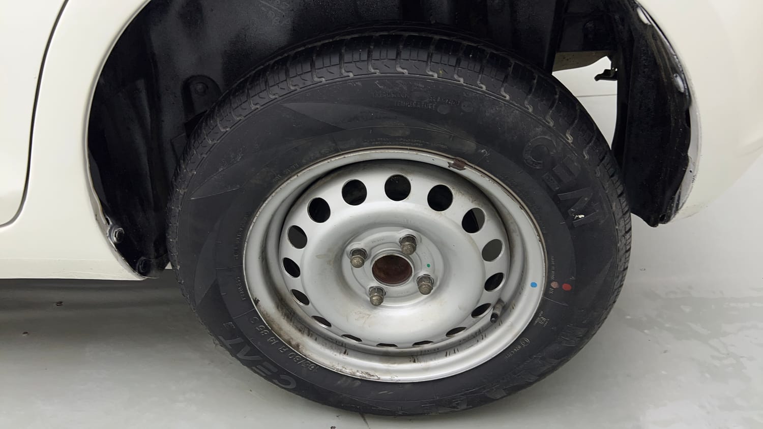 Used 2015 Maruti Suzuki Swift Lxi (O) Petrol Manual tyres LEFT REAR TYRE RIM VIEW