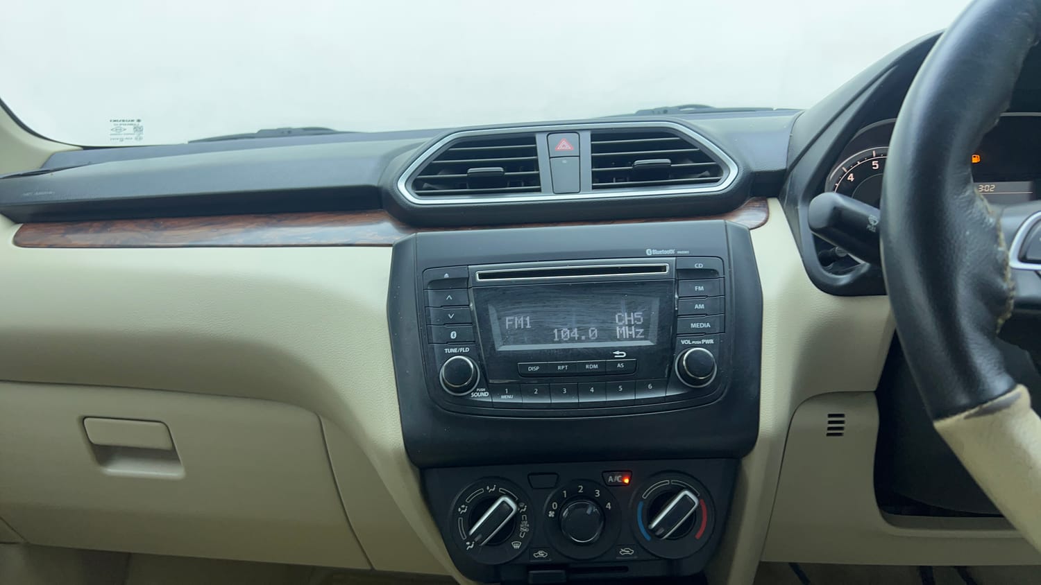Used 2018 Maruti Suzuki Dzire VXi Petrol Manual top_features Integrated (in-dash) music system