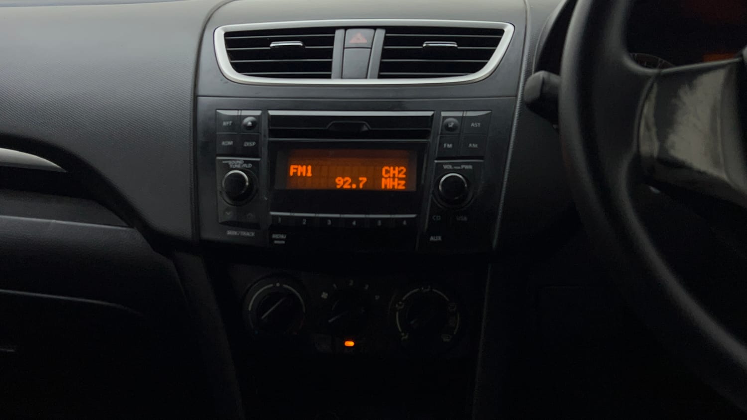 Used 2015 Maruti Suzuki Swift VXi Petrol Manual top_features Integrated (in-dash) music system