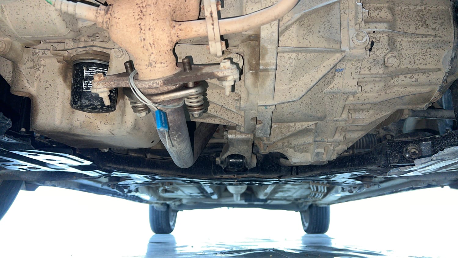 Used 2023 Maruti Suzuki XL6 Zeta MT CNG Cng Manual extra FRONT LEFT UNDERBODY VIEW