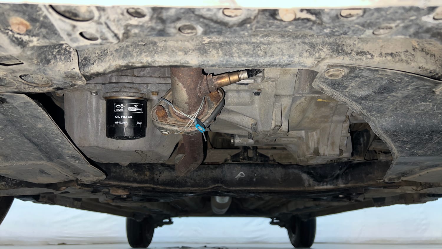 Used 2015 Maruti Suzuki Swift Lxi (O) Petrol Manual extra FRONT LEFT UNDERBODY VIEW