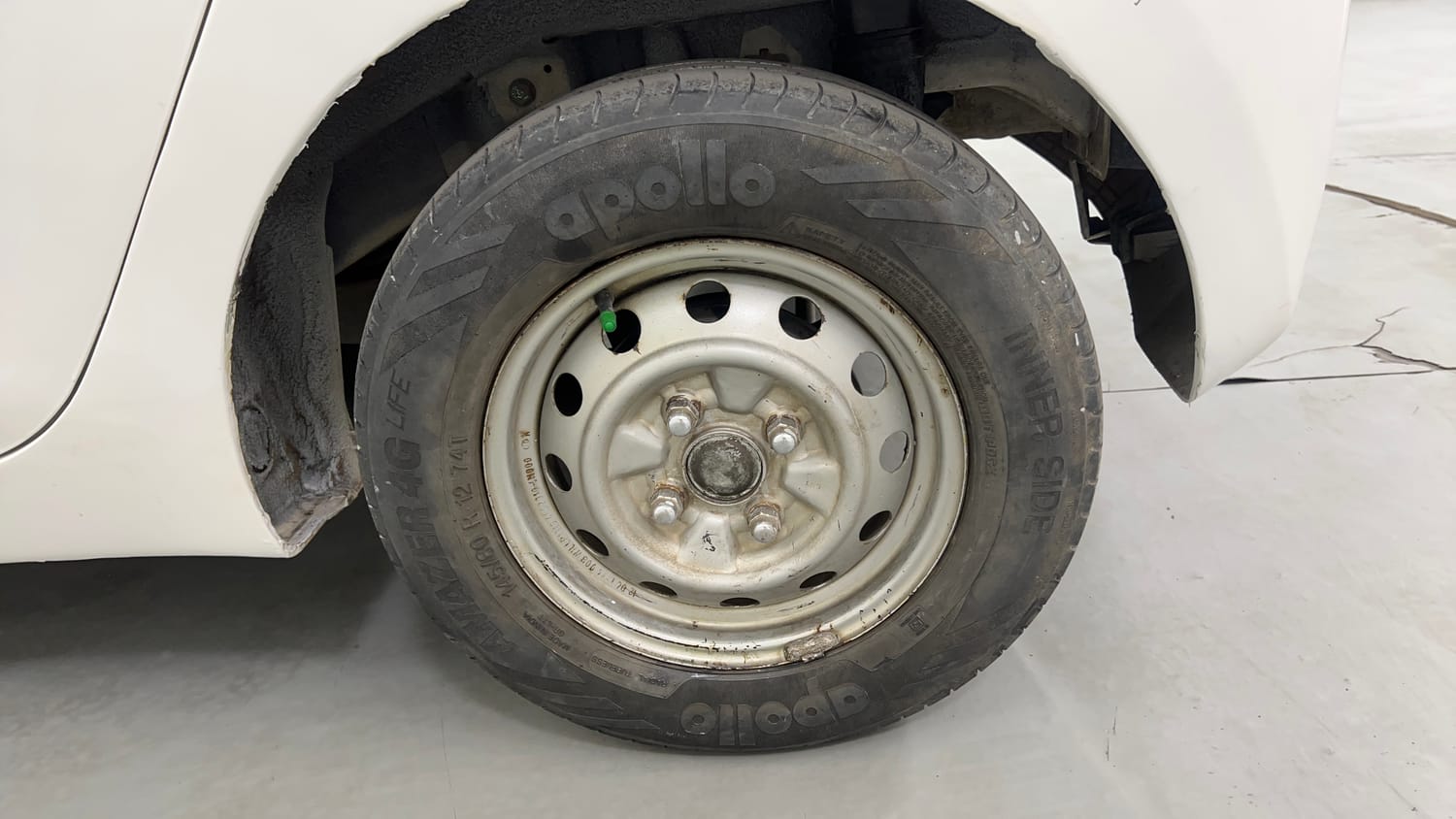 Used 2012 Hyundai Eon Era Petrol Manual tyres LEFT REAR TYRE RIM VIEW