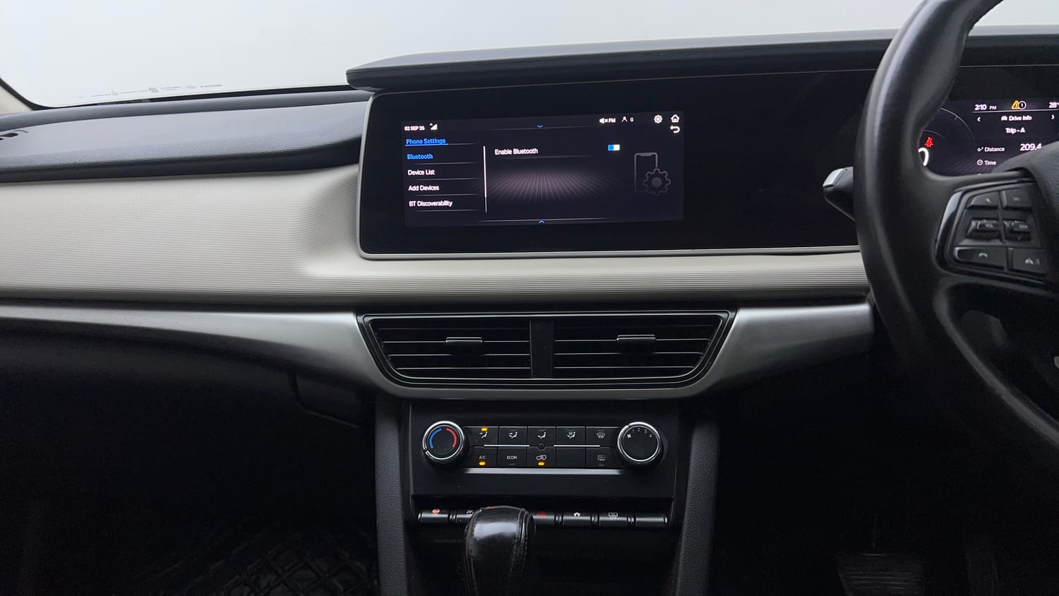 Used 2022 Mahindra XUV700 AX 3 Petrol AT 5 STR Petrol Automatic top_features Integrated (in-dash) music system
