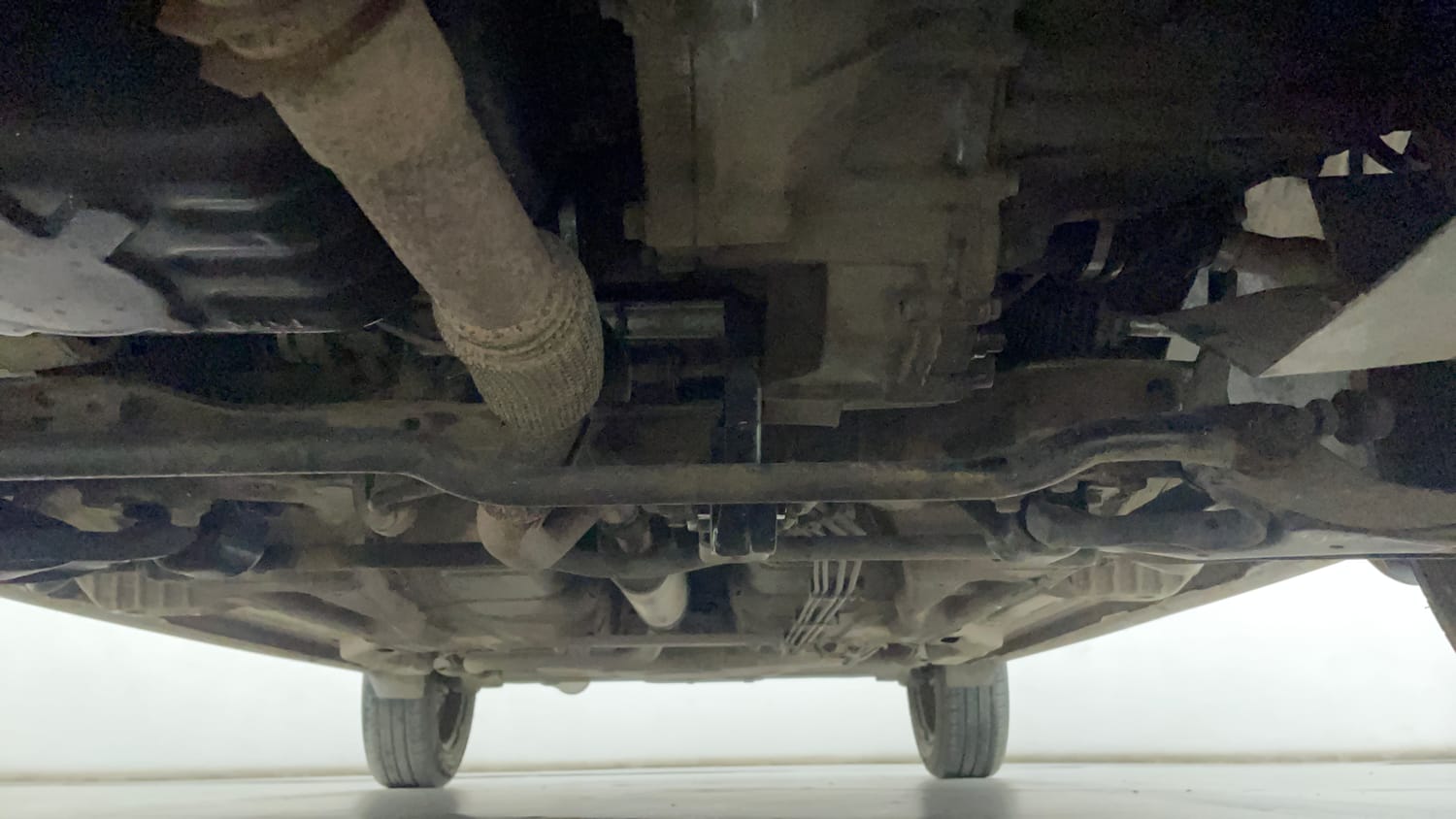Used 2016 Tata Tiago Revotron XT Petrol Manual extra FRONT LEFT UNDERBODY VIEW