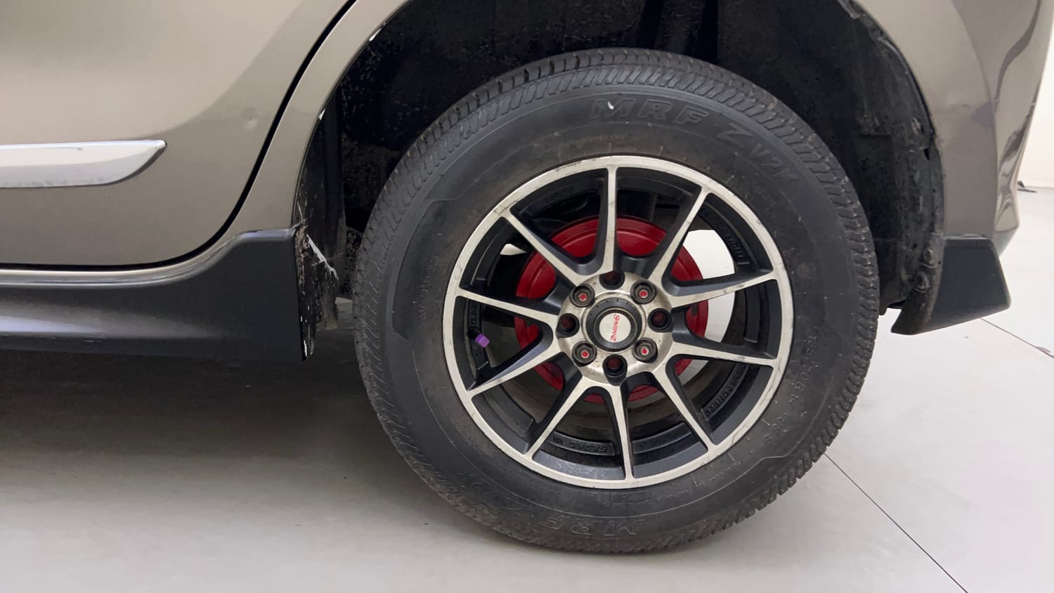 Used 2022 Maruti Suzuki Swift VXi AMT Petrol Automatic tyres LEFT REAR TYRE RIM VIEW
