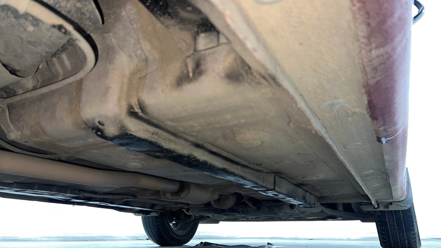 Used 2022 Hyundai Aura SX Plus 1.2 AMT Petrol Petrol Automatic extra REAR RIGHT UNDERBODY VIEW