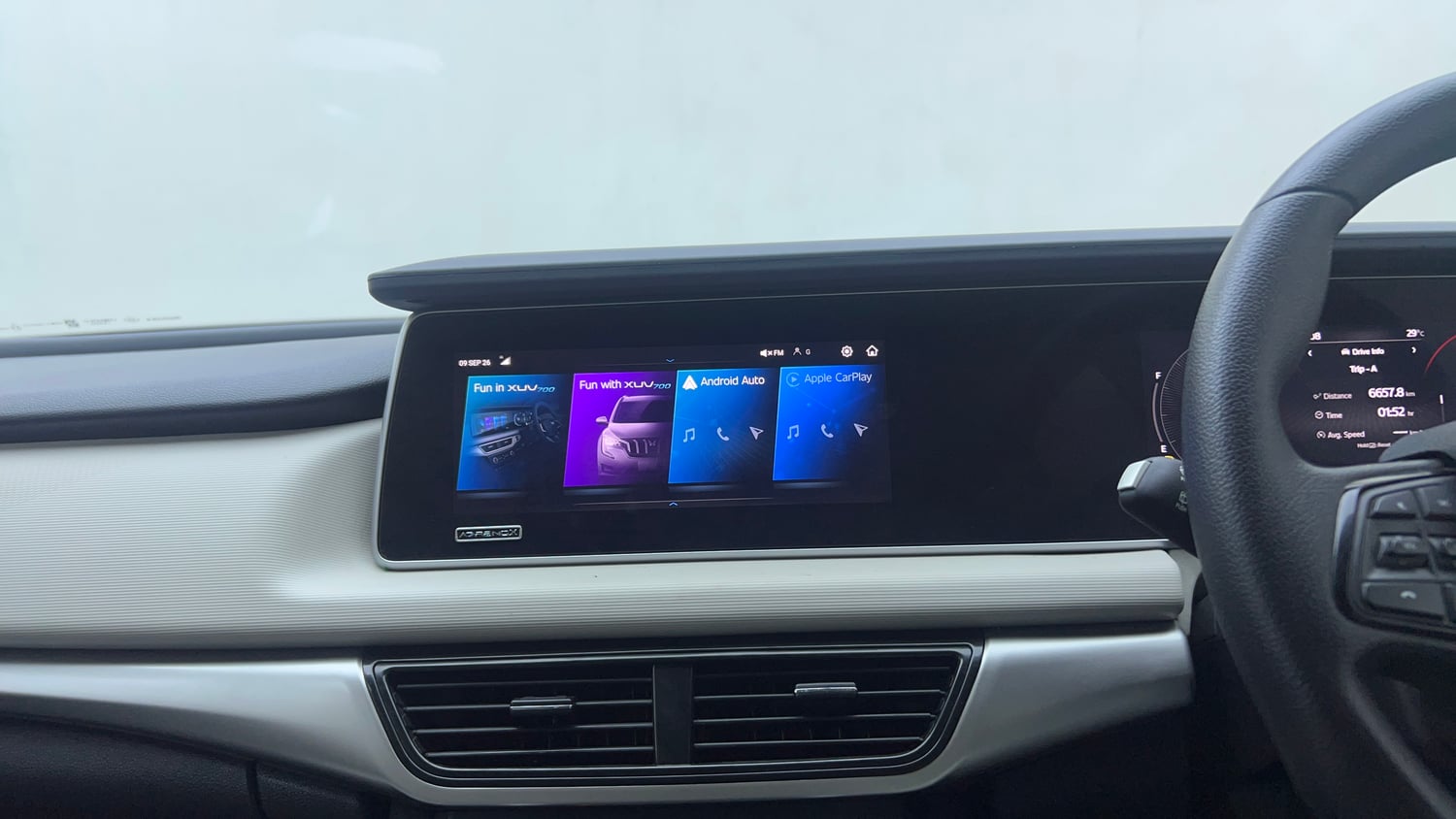 Used 2022 Mahindra XUV700 AX 5 Petrol AT 5 STR Petrol Automatic top_features Integrated (in-dash) music system