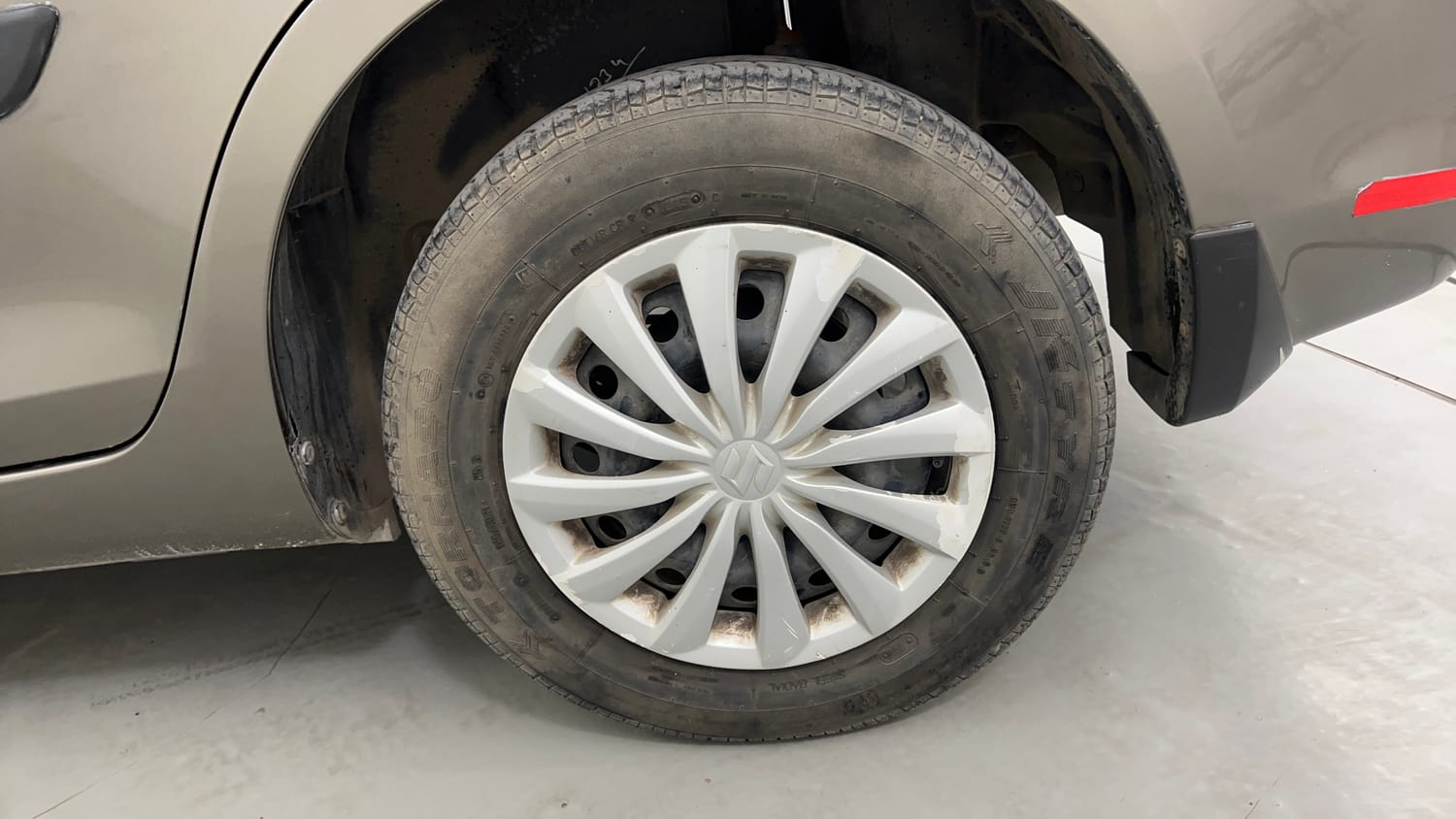 Used 2015 Maruti Suzuki Swift Dzire VXI Petrol Manual tyres LEFT REAR TYRE RIM VIEW