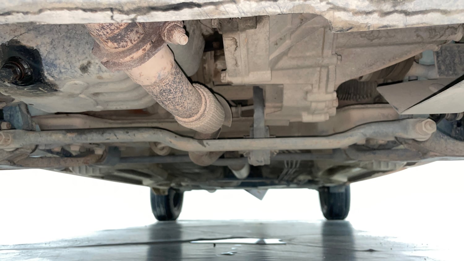 Used 2016 Tata Tiago Revotron XT Petrol Manual extra FRONT LEFT UNDERBODY VIEW
