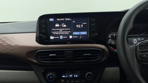 Used 2022 Hyundai Aura SX Plus 1.2 AMT Petrol Petrol Automatic top_features Integrated (in-dash) music system