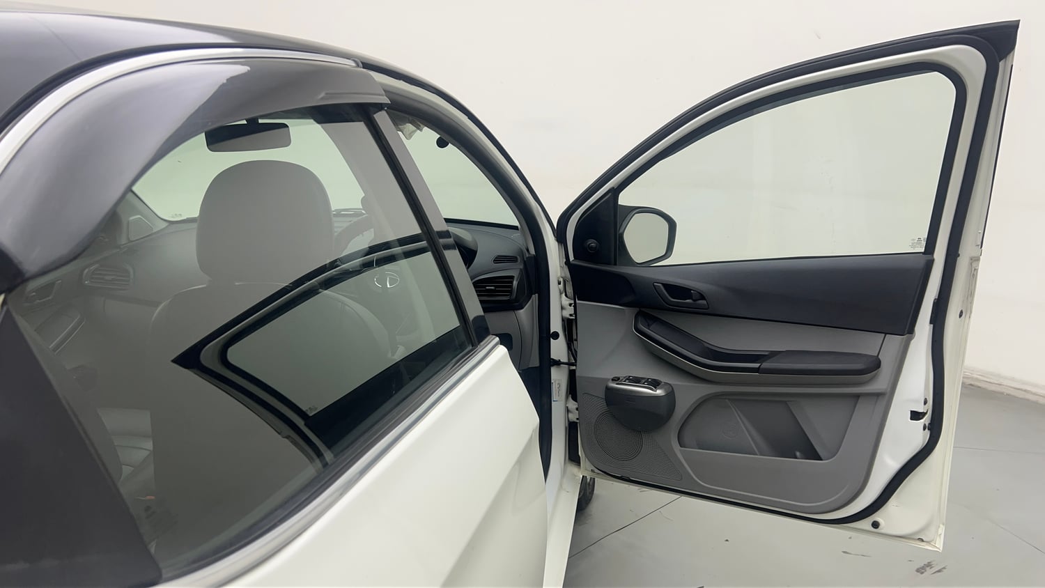 Used 2023 Tata Tiago XE Petrol Manual interior RIGHT FRONT DOOR OPEN VIEW