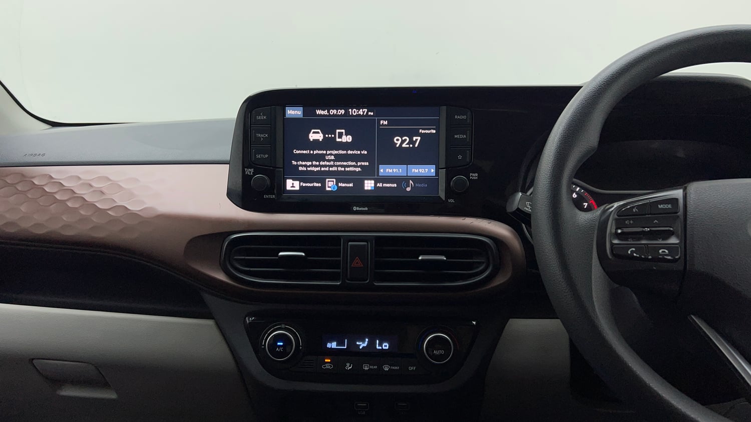 Used 2022 Hyundai Aura SX Plus 1.2 AMT Petrol Petrol Automatic interior MUSIC SYSTEM & AC CONTROL VIEW