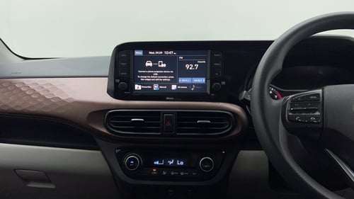 Used 2022 Hyundai Aura SX Plus 1.2 AMT Petrol Petrol Automatic interior MUSIC SYSTEM & AC CONTROL VIEW