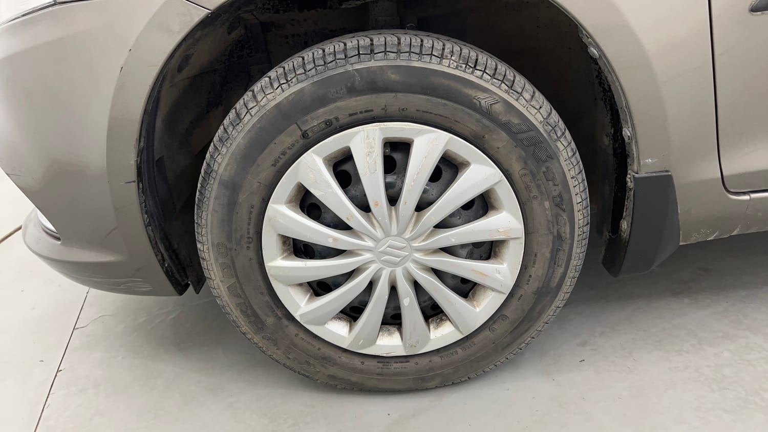 Used 2015 Maruti Suzuki Swift Dzire VXI Petrol Manual tyres LEFT FRONT TYRE RIM VIEW