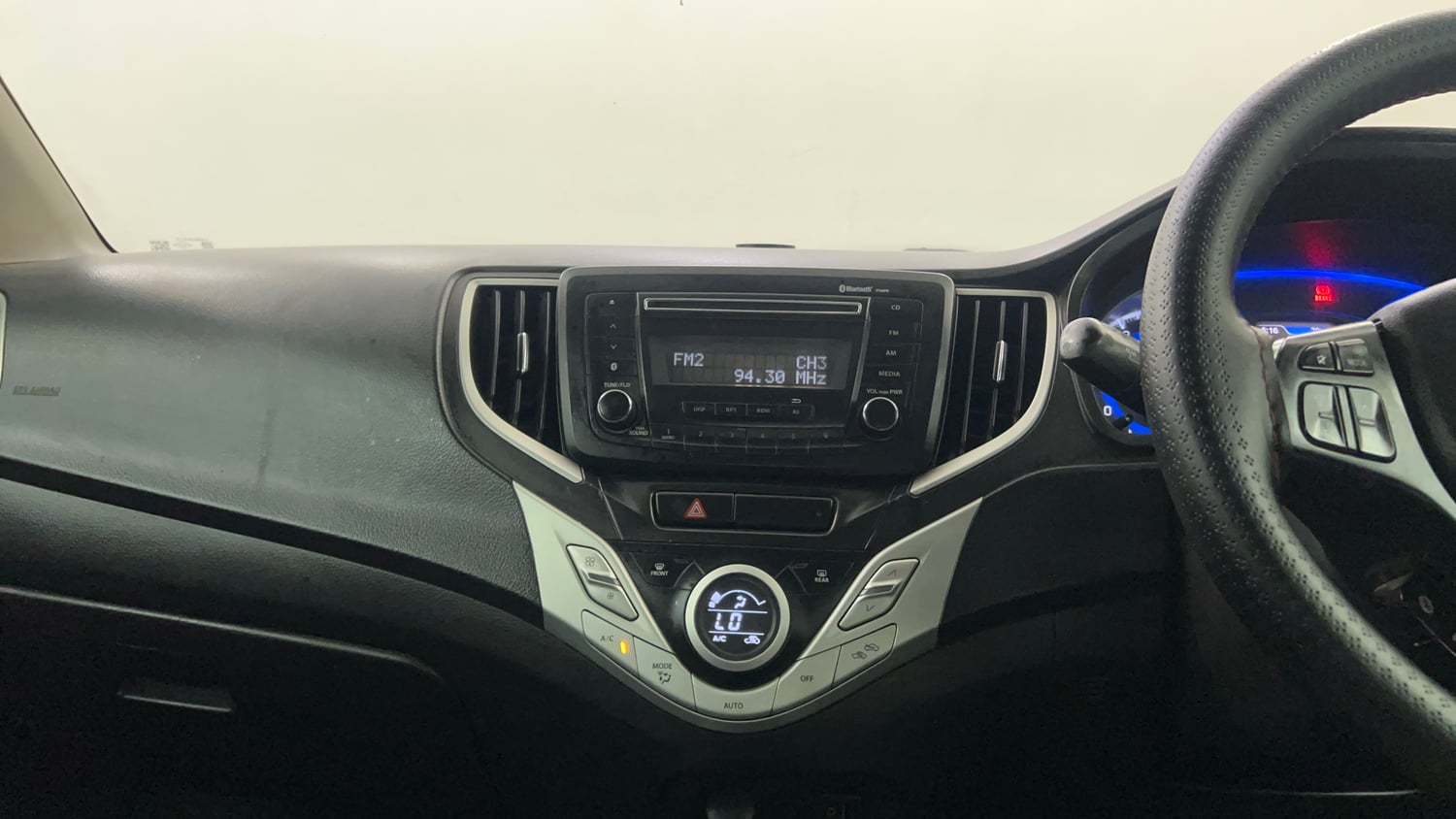 Used 2017 Maruti Suzuki Baleno Zeta 1.2 Petrol Manual interior MUSIC SYSTEM & AC CONTROL VIEW