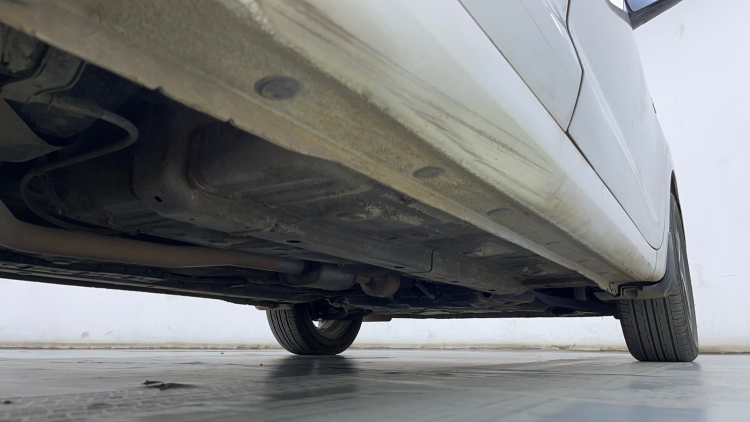 Used 2021 Hyundai Aura SX Plus 1.2 AMT Petrol Petrol Automatic extra REAR RIGHT UNDERBODY VIEW