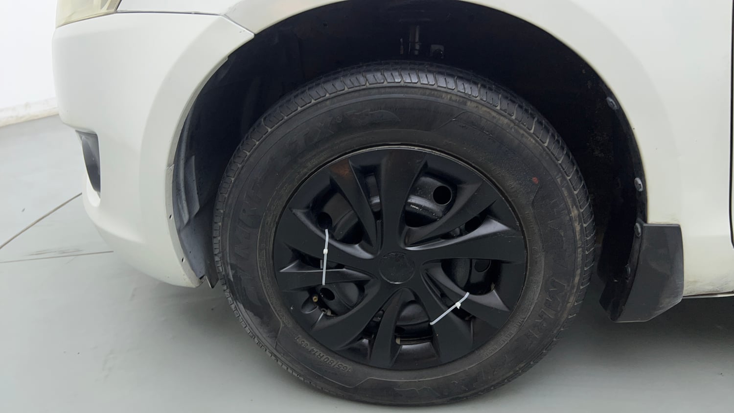 Used 2014 Maruti Suzuki Swift LXi Petrol Manual tyres LEFT FRONT TYRE RIM VIEW