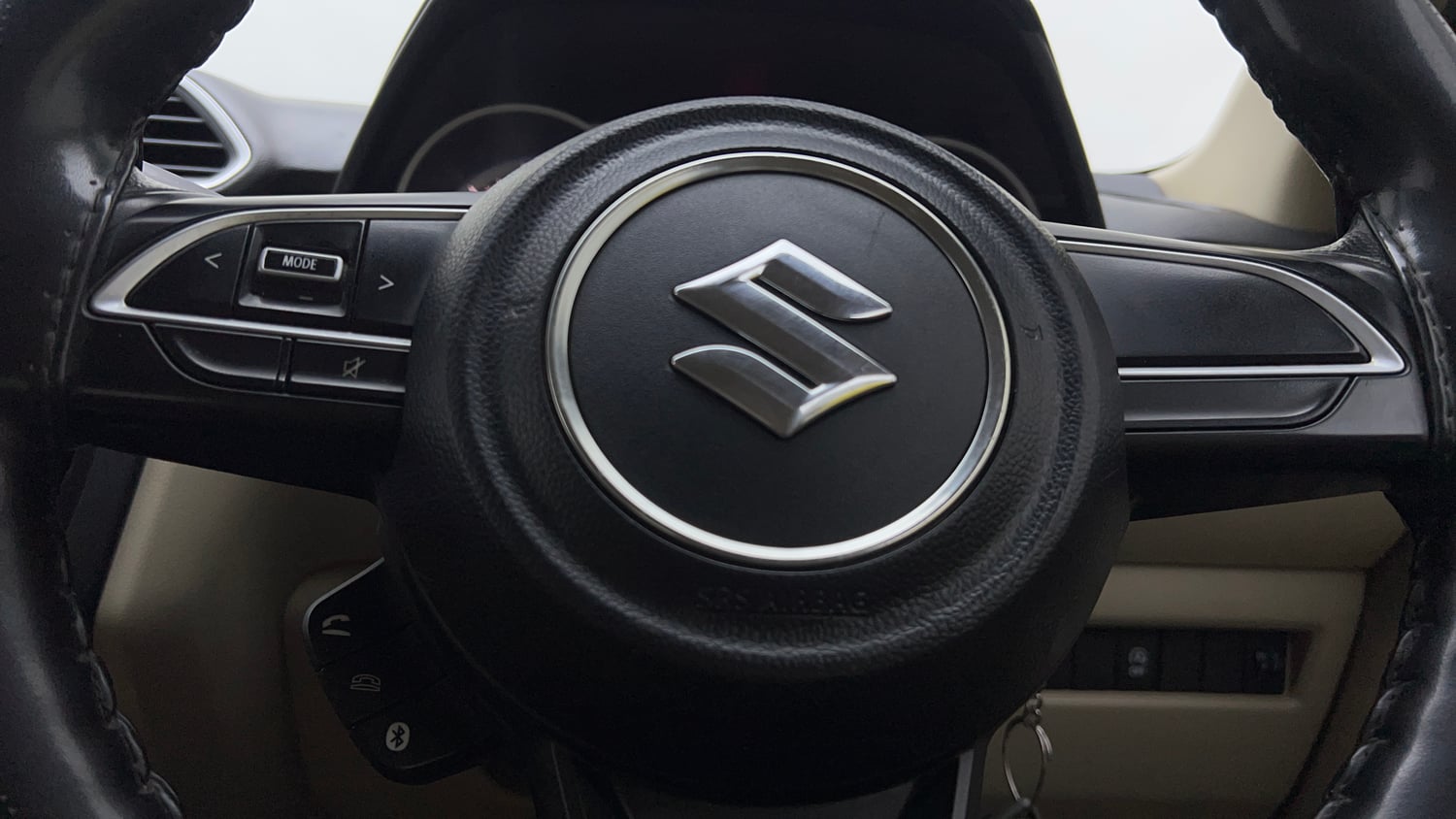 Used 2022 Maruti Suzuki Dzire VXi Petrol Manual top_features Steering mounted controls
