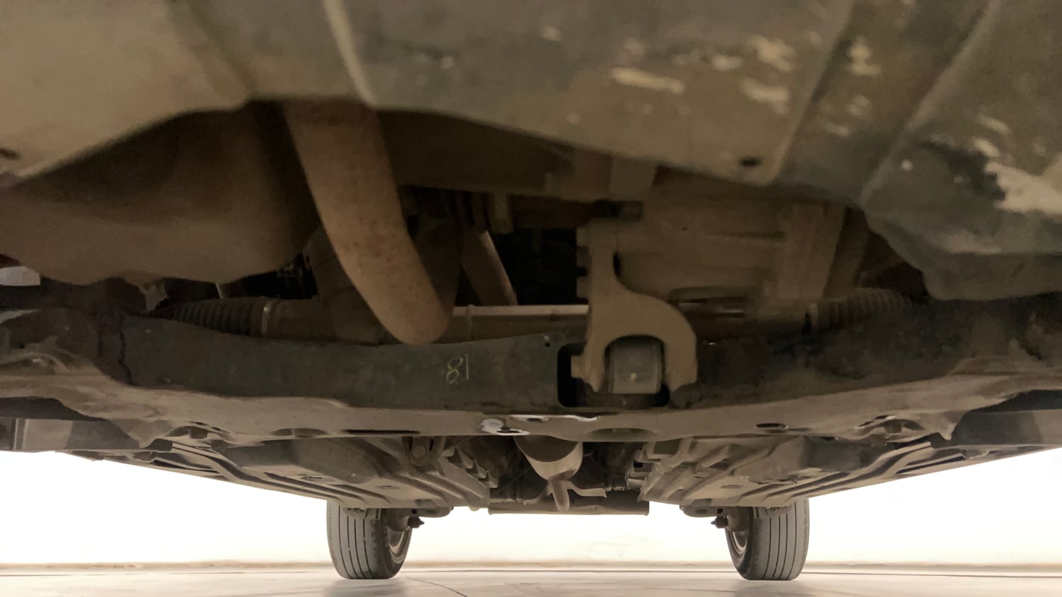 Used 2022 Maruti Suzuki Vitara Brezza VXi AT SHVS Petrol Automatic extra FRONT LEFT UNDERBODY VIEW