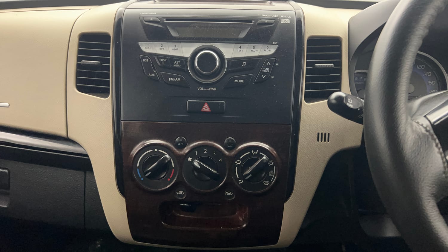 Used 2018 Maruti Suzuki Wagon R 1.0 VXI AMT Petrol Automatic top_features Integrated (in-dash) music system