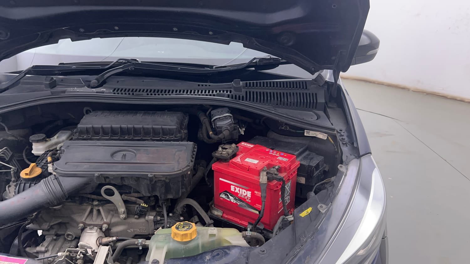 Used 2022 Tata Tigor XZ Plus Petrol Manual engine ENGINE LEFT SIDE HINGE & APRON VIEW