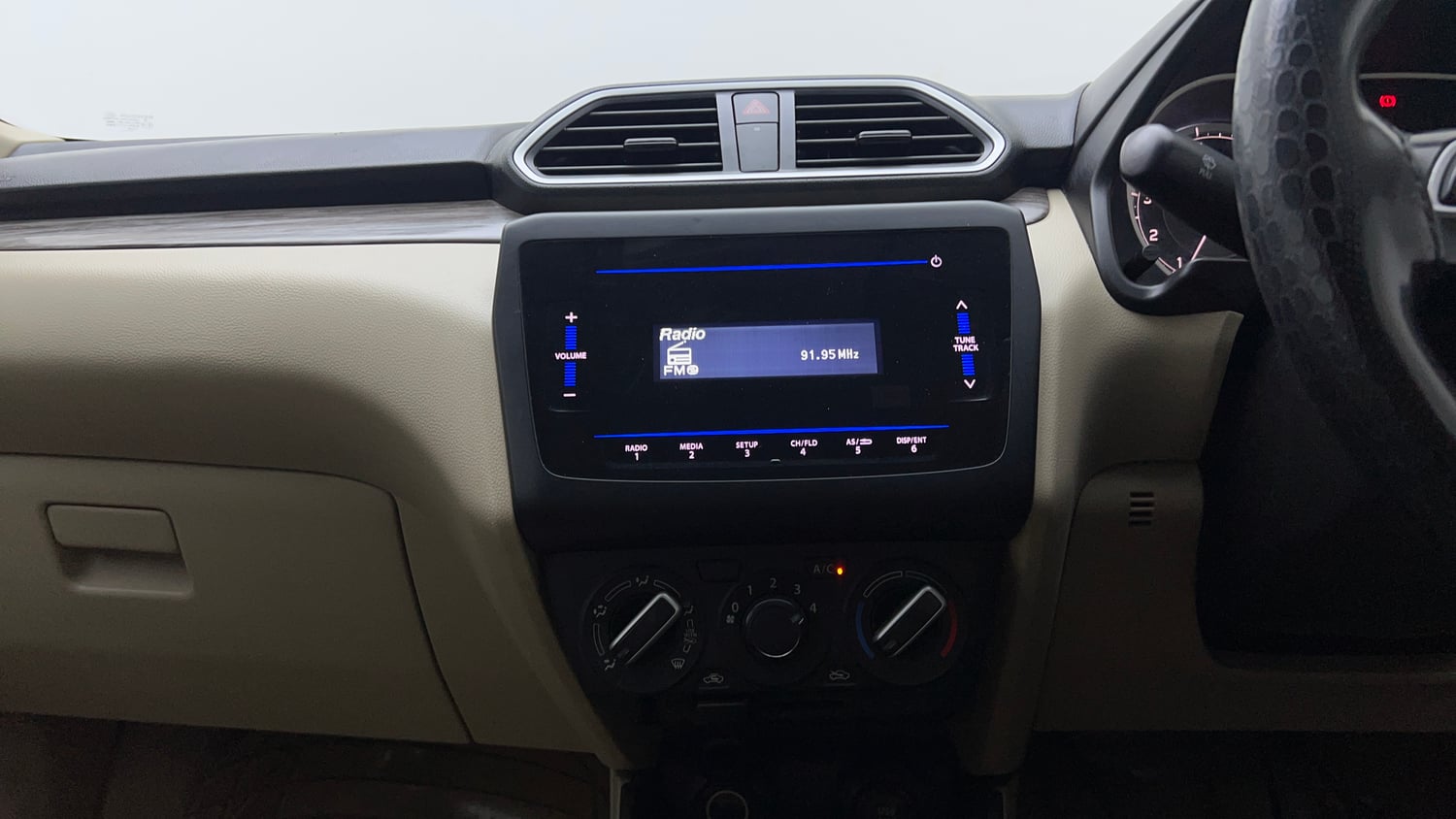 Used 2022 Maruti Suzuki Dzire VXi Petrol Manual top_features Integrated (in-dash) music system