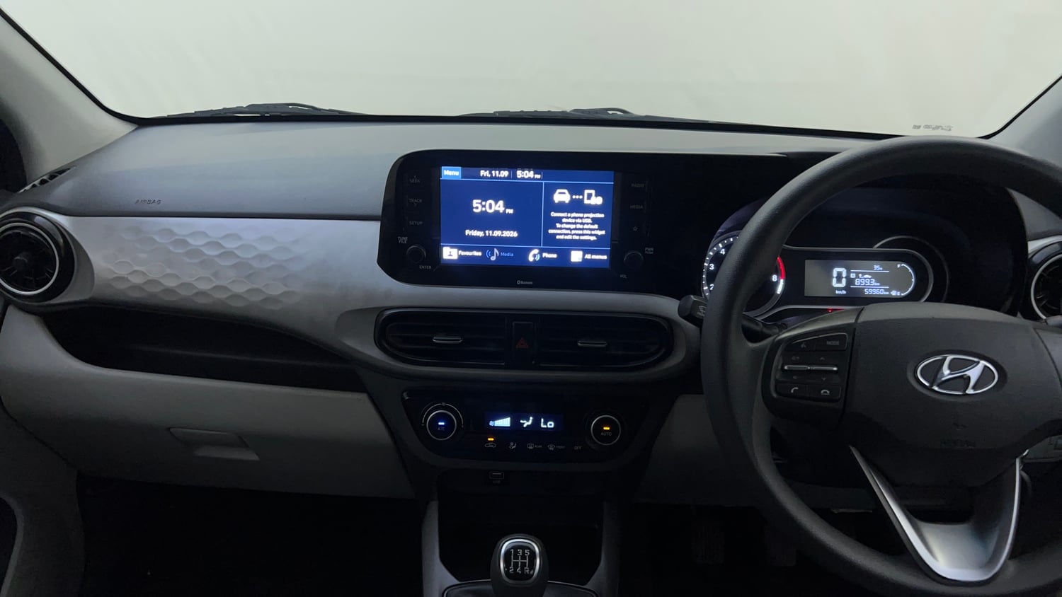 Used 2021 Hyundai Grand i10 Nios Sportz 1.2 Kappa VTVT Petrol Manual interior MUSIC SYSTEM & AC CONTROL VIEW