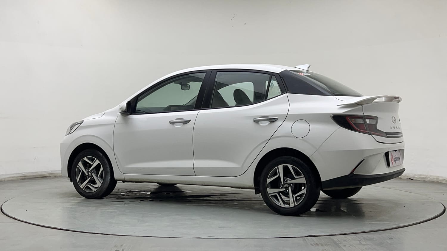 Used 2024 Hyundai Aura SX Plus 1.2 AMT Petrol Petrol Automatic exterior LEFT REAR CORNER VIEW