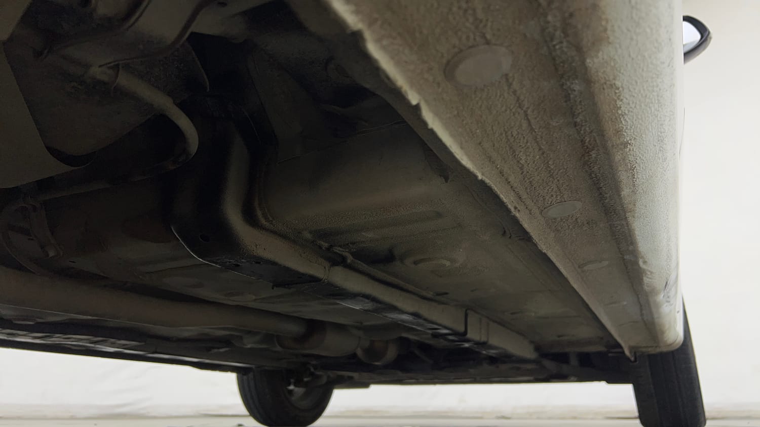 Used 2024 Hyundai Aura SX Plus 1.2 AMT Petrol Petrol Automatic extra REAR RIGHT UNDERBODY VIEW